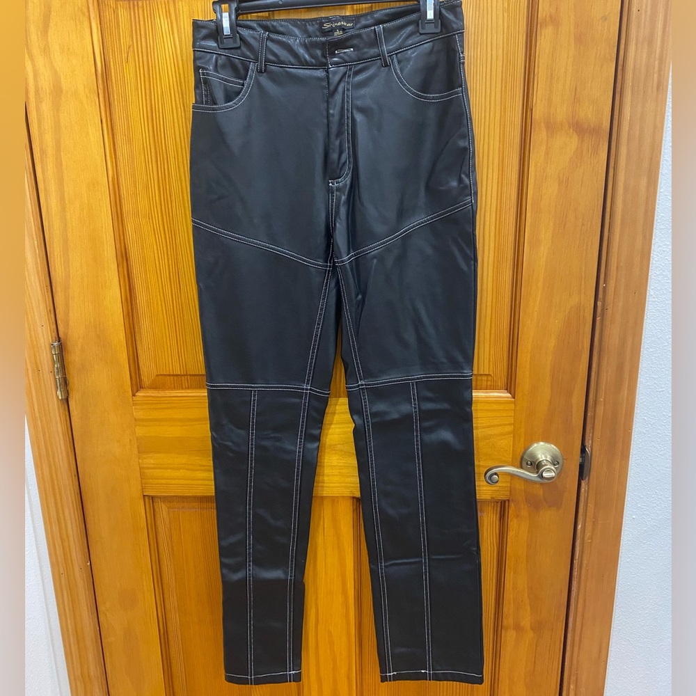Faux leather pants with white stitching. Size S. Lightly worn in good condition.